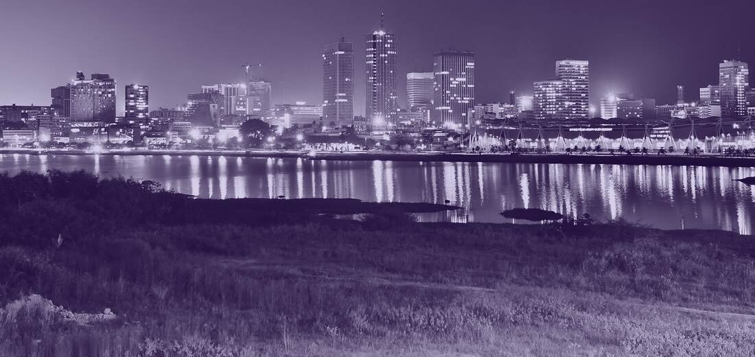 The Plateau business district of Abidjan at dusk, across the lagoon.